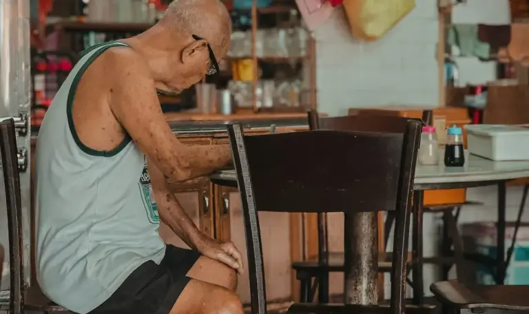 old man sitting restaurant