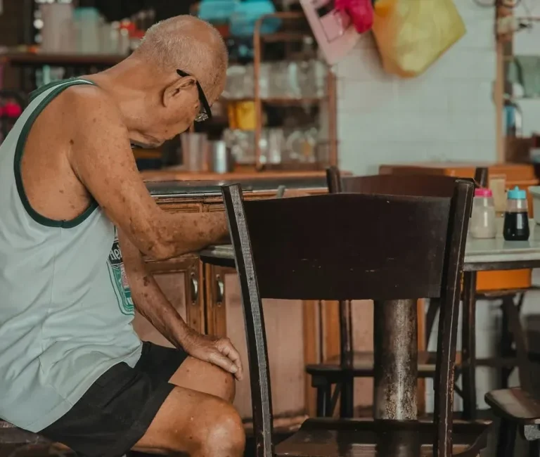 old man sitting restaurant