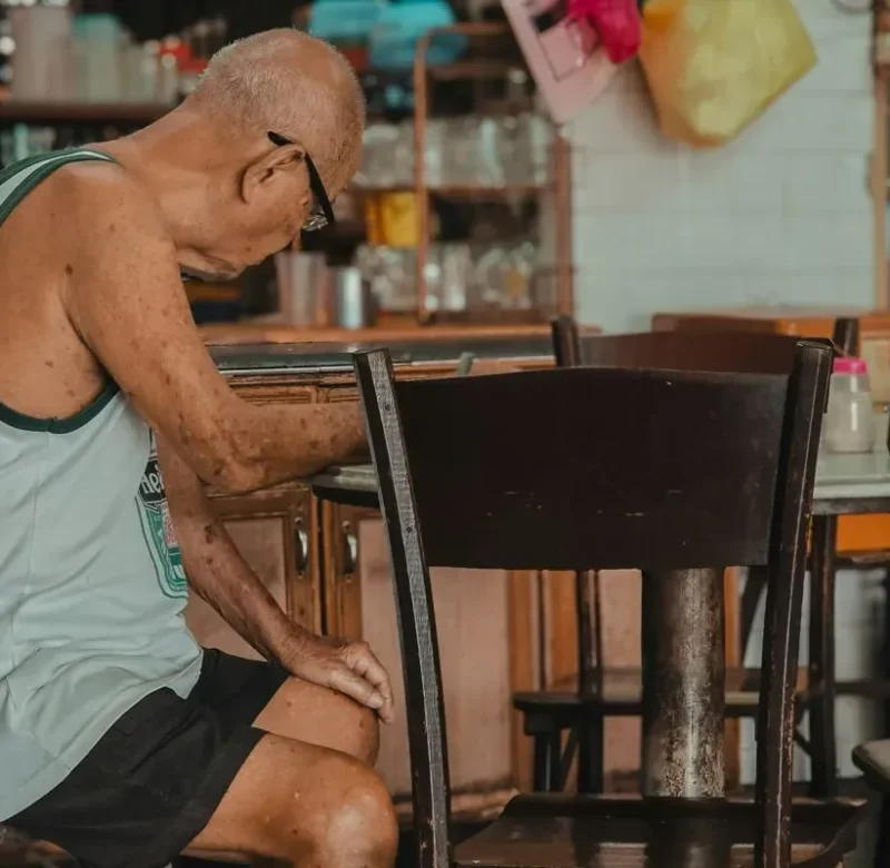old man sitting restaurant
